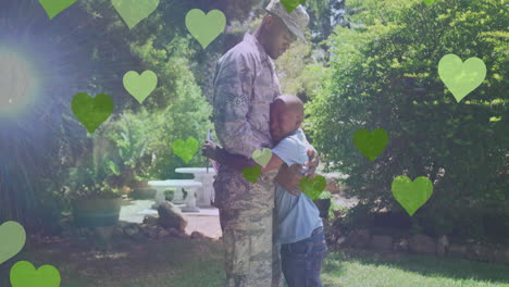 animación de corazones sobre feliz soldado afroamericano padre abrazando a su hijo