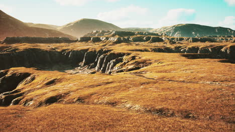 Grasslands-wide-panorama-with-autumn-grass-field-and-mountains