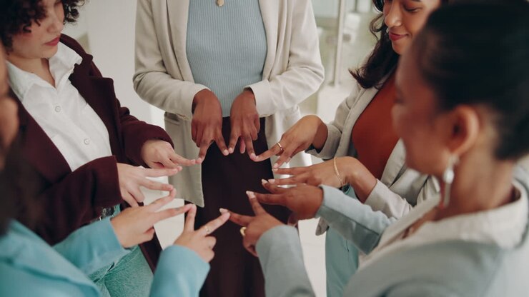 Group of businesswomen playing a game together