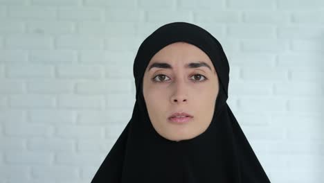 crying muslim woman in a black hijab violence and restriction of freedoms to women in the middle east. war in the islamic world brings many tears. women in the sharia world