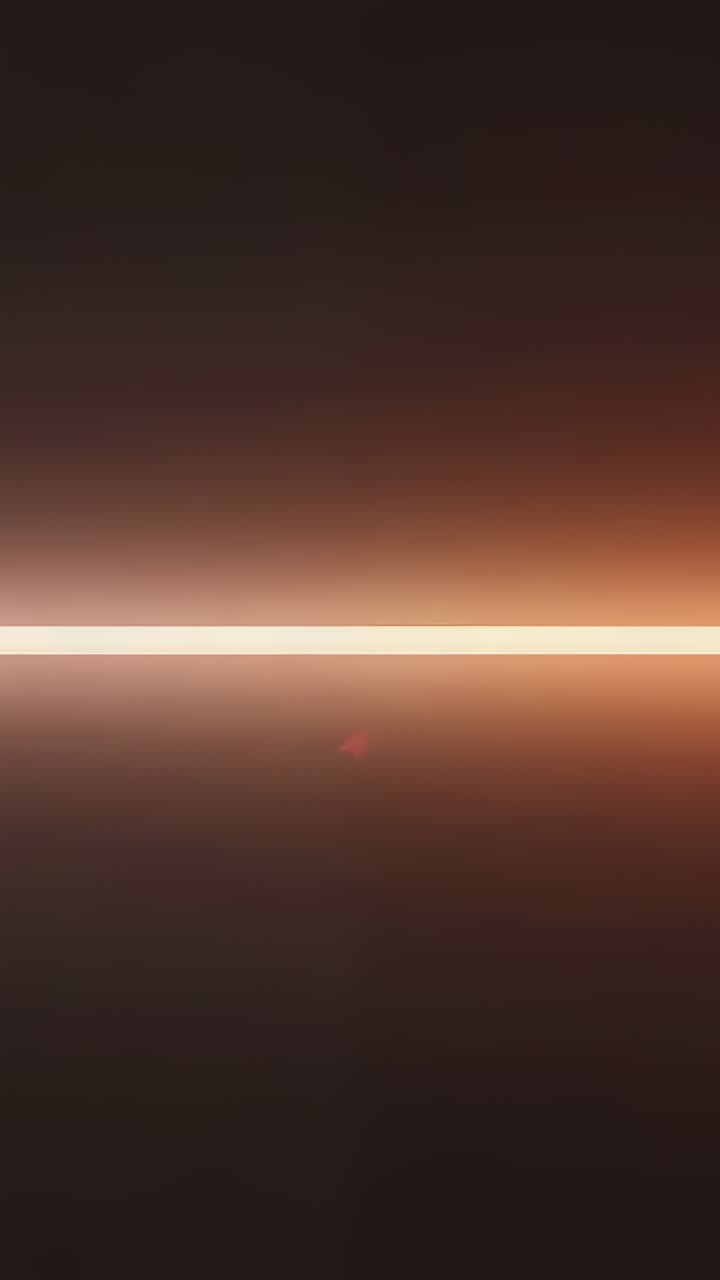 Vertical video: Looping pulsing LED bar shifting glow on amber gradient, showing red flare for demo