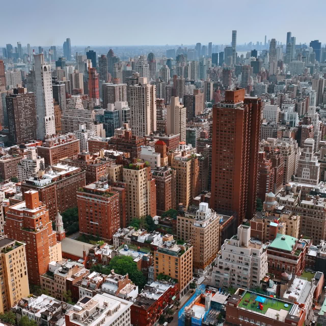 Diversity of New York architecture. Drone footage above the cityscape on bright sunny day