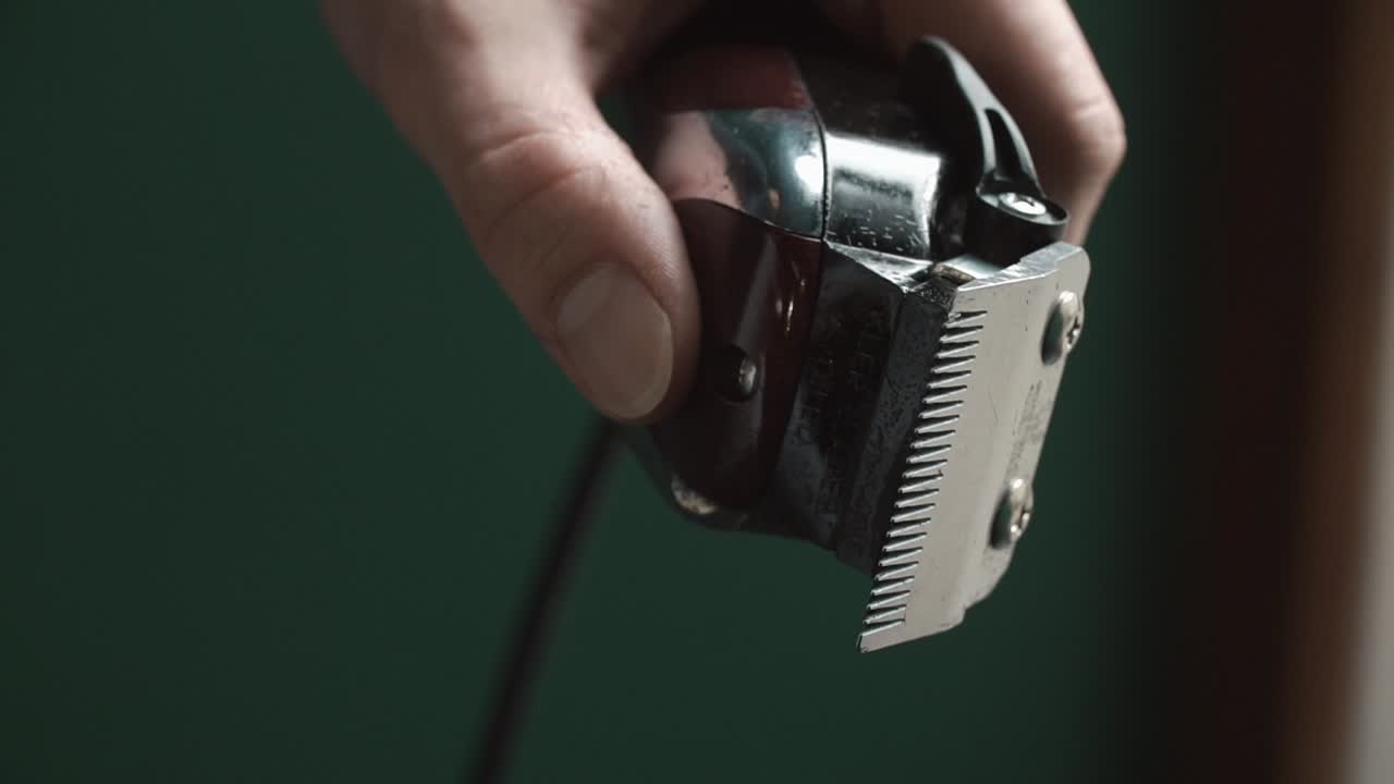 Hand holding hair clippers