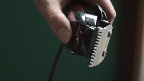hand holding hair clippers