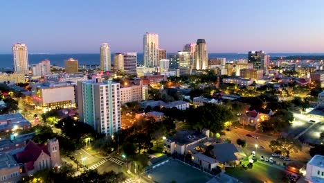 4K-Aerial-Dolly-Video-Flying-Towards-Downtown-St-Petersburg,-FL-at-Dusk