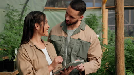 farmers in a greenhouse