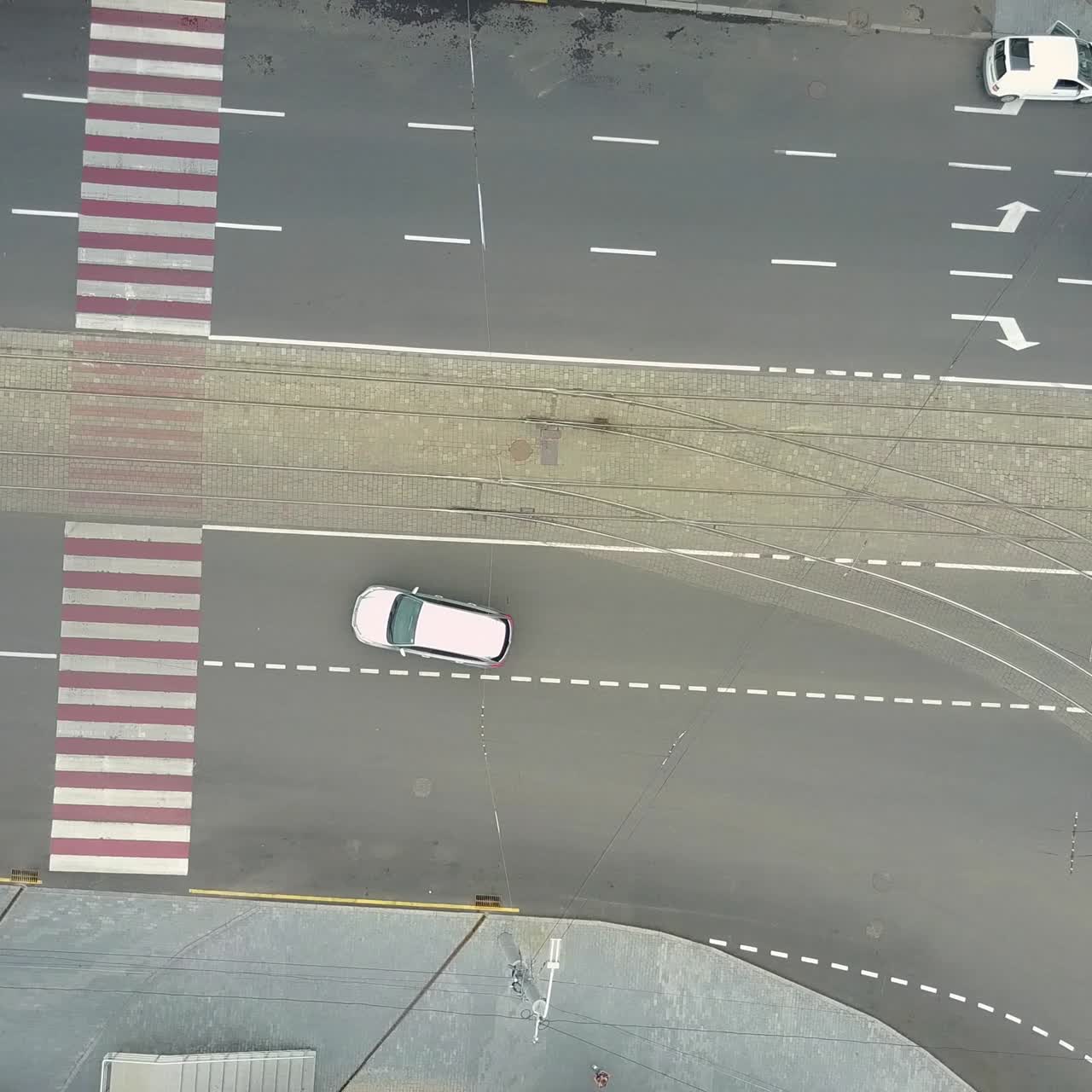 Traffic Jam And Urban Transport. Crossroads in the city, cars drive through part of the road, aerial view