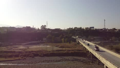 transport and people cross the main bridge of havelian in pakistan connecting the city with the city of abbottabad in the khyber pakhtunkhwa province