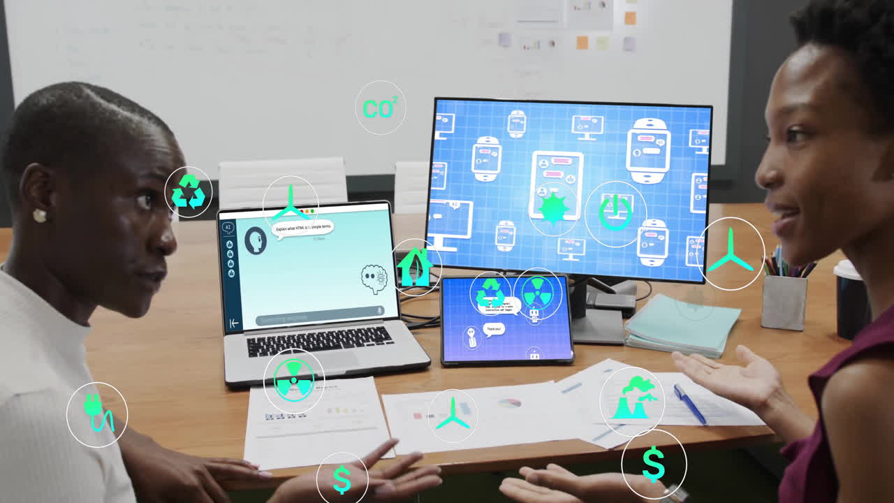 Animation of ecology icons over diverse female colleagues discussing work in office