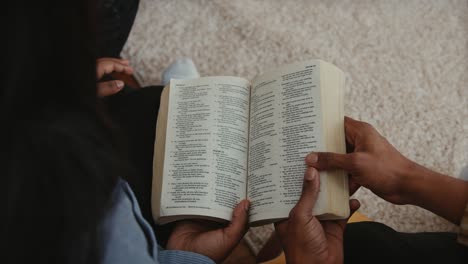 african american christian couple reading the scriptures of