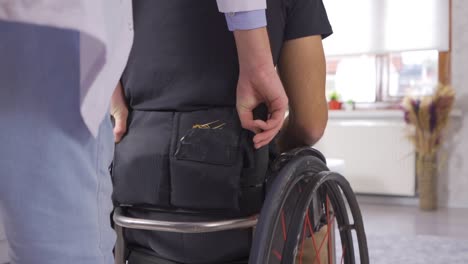 Young-man-moving-in-wheelchair-in-slow-motion.