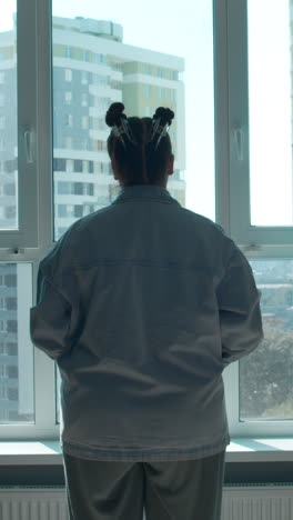 woman looking out of a window