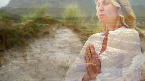 mujer meditando cerca de la playa 4k