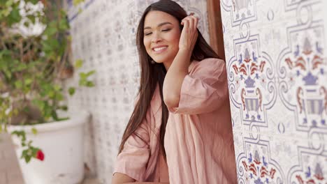 smiling woman in a pink shirt outdoors