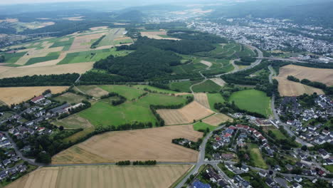 aerial view of rural landscape with fields, towns, and highways