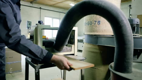 carpenter workplace. man using saw to cut wood