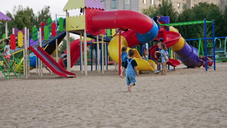 children playing at a colorful playground
