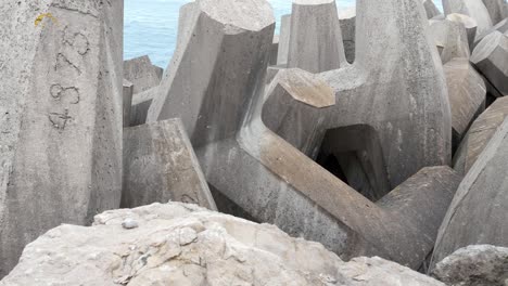 numbered concrete formed coastline defence geometric shape engineering on shoreline slow left