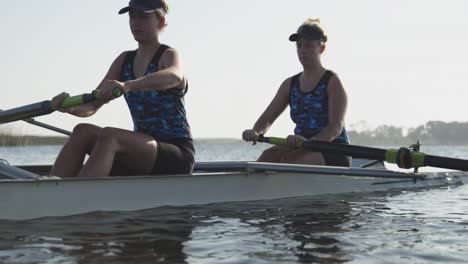 female rowers training on a river