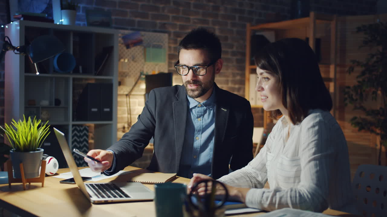 Business colleagues collaborating late night in the office