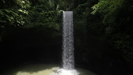 moving toward the tibumana waterfall on a sunny afternoon in bali, indonesia
