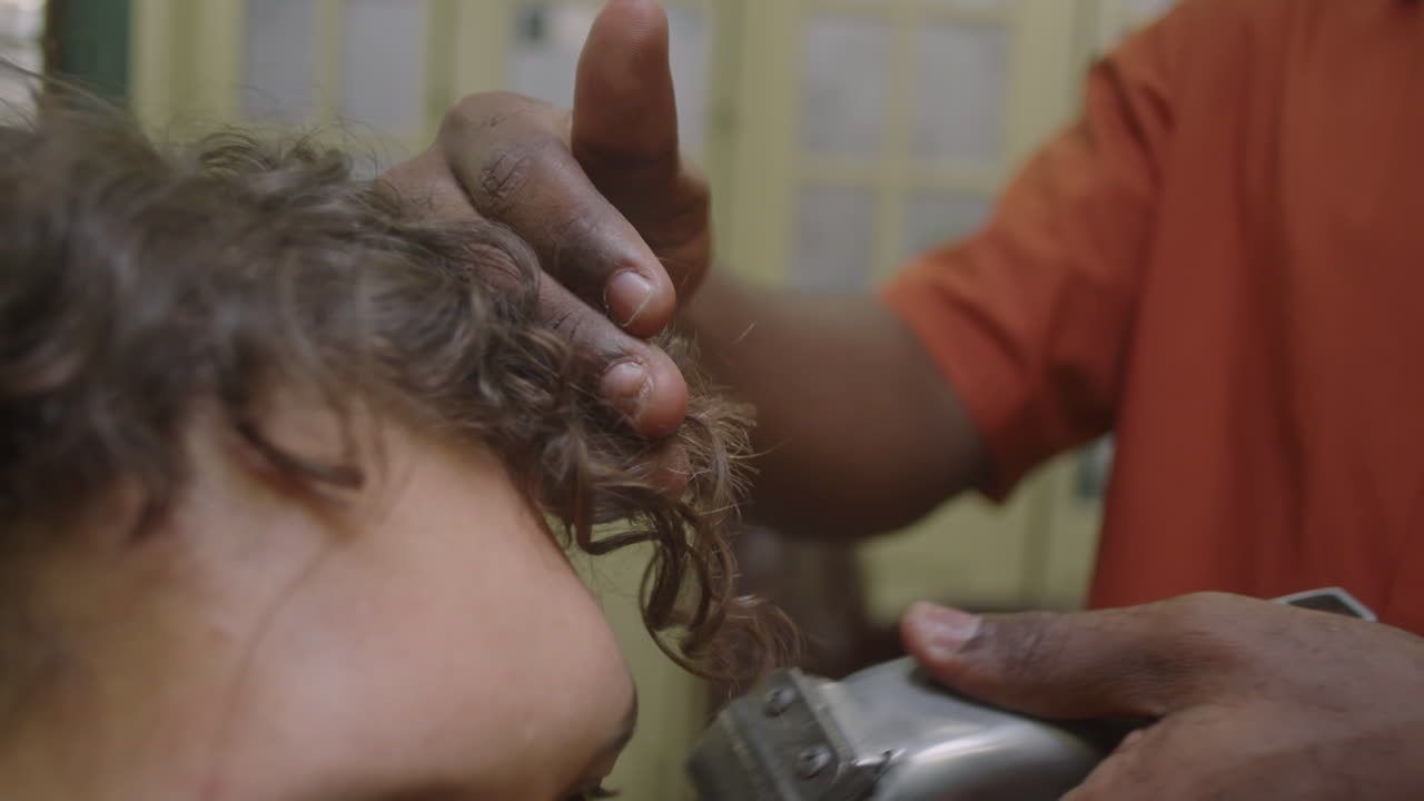 Barber Doing Haircut with Hair Clippers