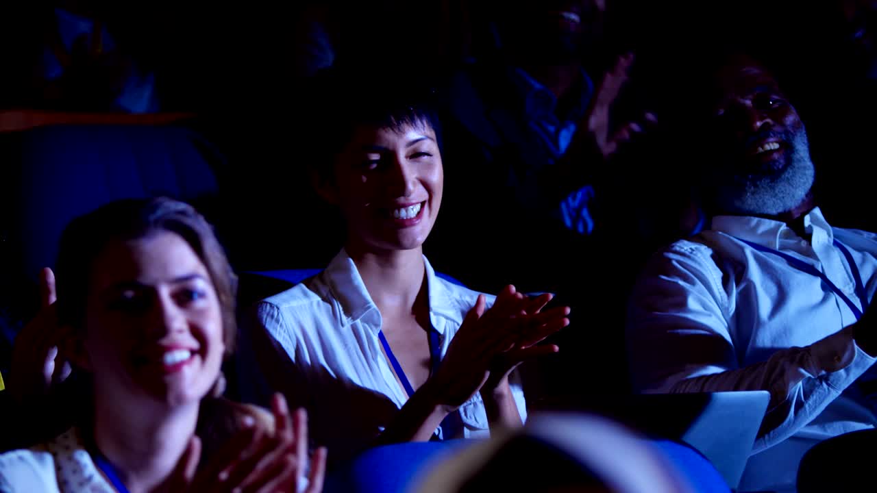 Business people applauding in business seminar at auditorium 4k