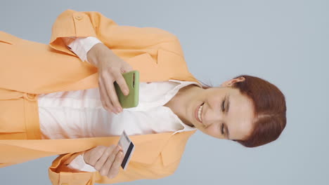 Vertical-video-of-Business-woman-shopping-with-credit-card.