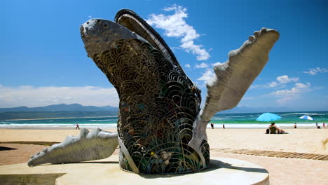 steel sculpture of breaching humpback whale installed at central beach, plett