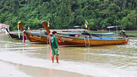 longtail boats on a tropical beach