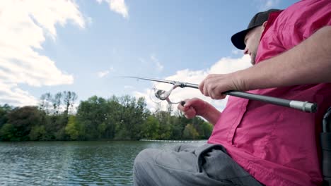 person with a physical disability who uses wheelchair fishing from fishing pier