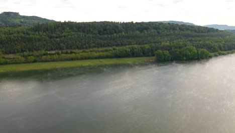 Drone-flies-over-a-dam-on-the-side-of-the-highway