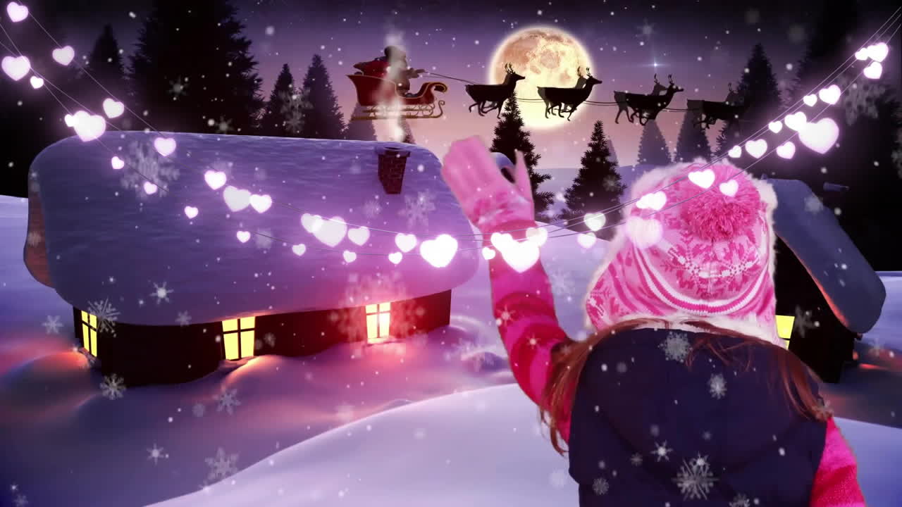 Watching animation of Santa's sleigh flying, child amazed by glowing heart lights