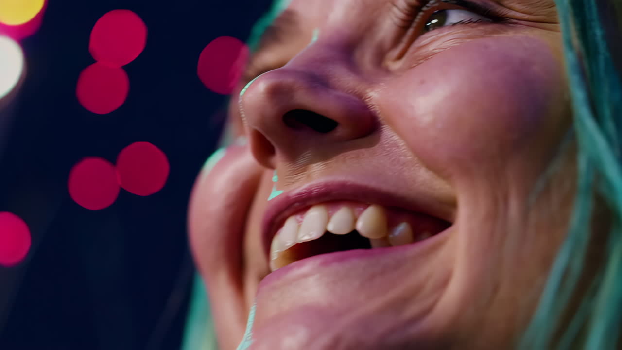 Woman with Teal Hair Smiling at Night Lights