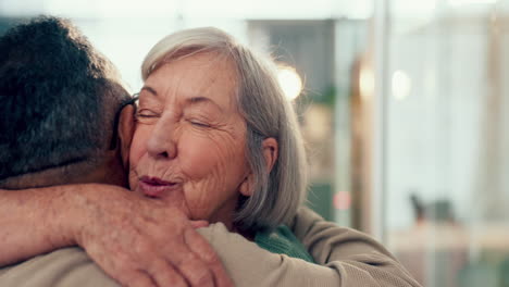 Love,-hug-and-an-elderly-couple-in-their-home