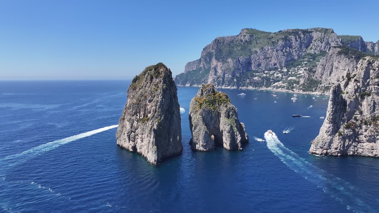 Faraglioni Island At Capri In Naples Italy. Beach Landscape. Giant Cliffs Scene. Faraglioni Island At Capri In Naples Italy. Gulf Of Naples Skyline. Mediterranean Sea Coast. Scenic Capri Island