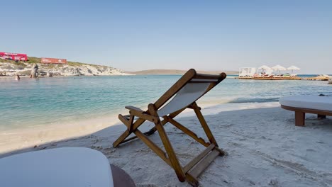 Blue-flag-beach-club-in-Izmir-Cesme-Alacati,-beach-umbrellas,-chairs,-beach-party-in