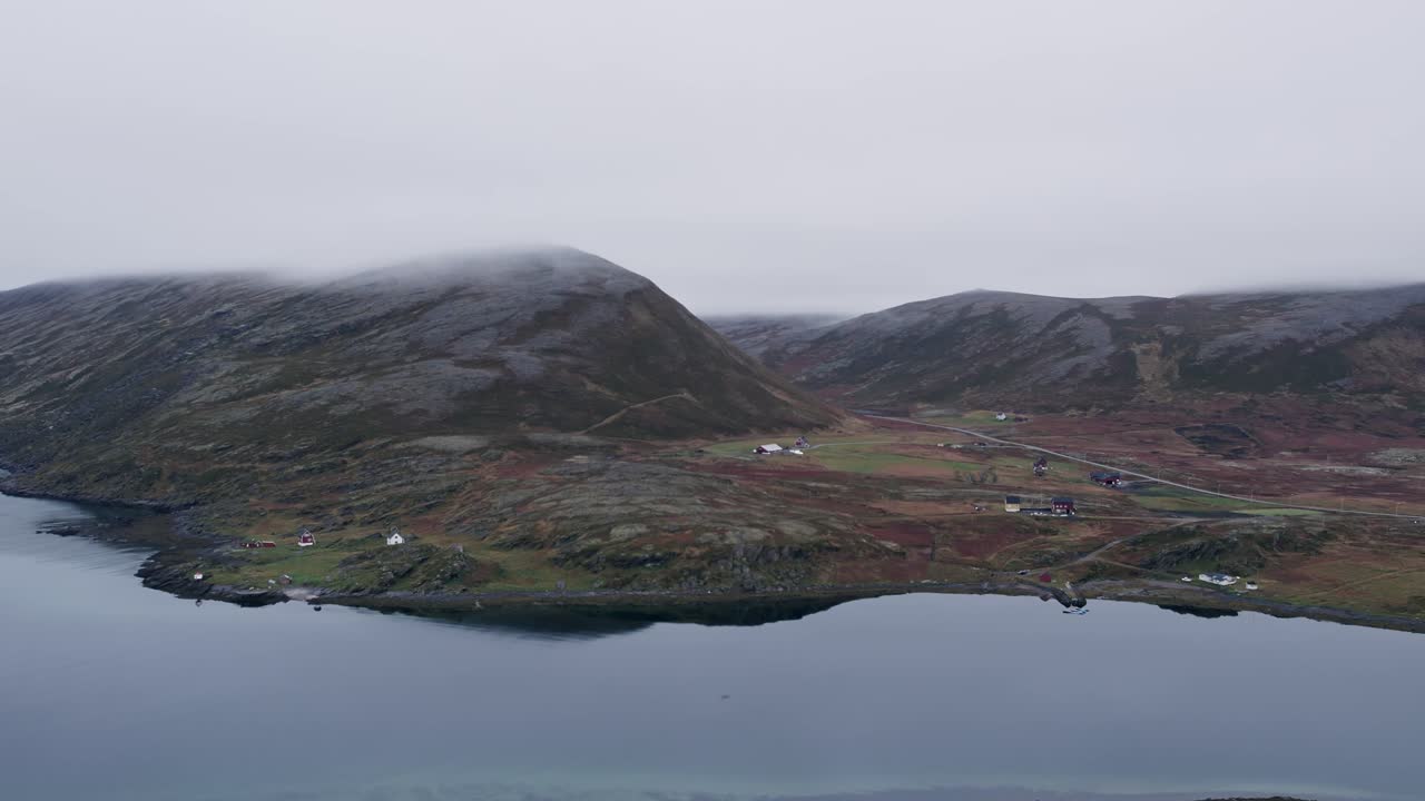 Peaceful and mysterious atmosphere of the northern coastline with a small houses