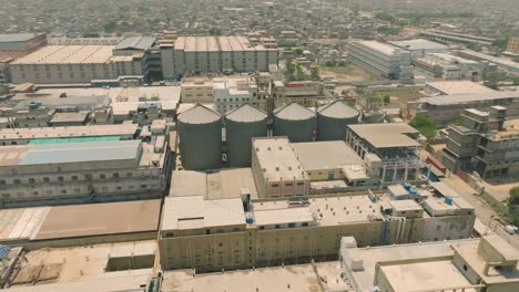 aerial view of an industrial complex with silos and buildings