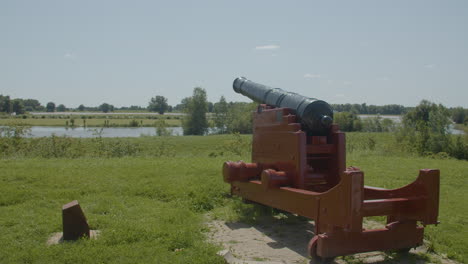 Wide-shot-of-old-cannon-overlooking-beautiful-Dutch-landscape