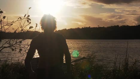 young man beaches row boat walks out of frame