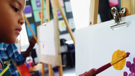 attentive schoolgirl panting on canvas