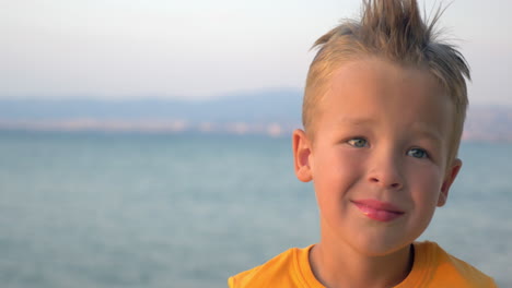 little blond child on sea background