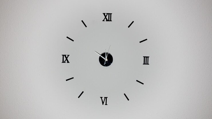 Clock on white background and movement of clock hands. Time lapse clock with three arrow hands moving fast