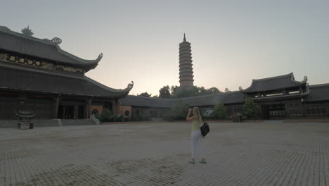 Woman-making-photos-of-Bai-Dinh-Temple-Vietnam