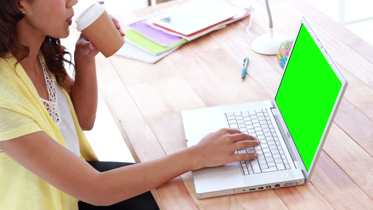 Casual businesswoman working on laptop