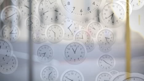 animation of clocks falling and moving over people walking in city