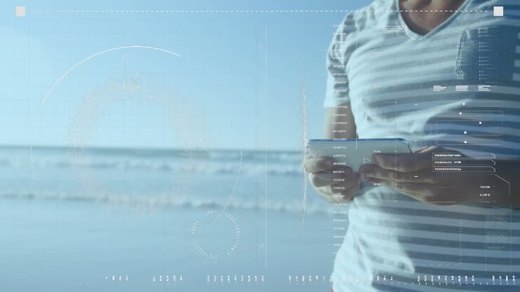 Animation of data processing over happy caucasian man using tablet at beach