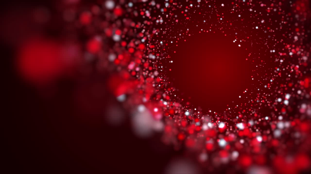 Red swirl of bright glowing particles on a dark animated background. Bright looped abstract motion graphics.
