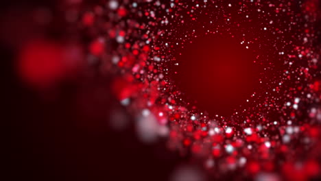 Red swirl of bright glowing particles on a dark animated background. Bright looped abstract motion graphics.